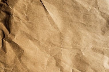 Boş kahverengi buruşmuş kağıt dokusu arka planı, el işi tasarımı için eski sayfa.
