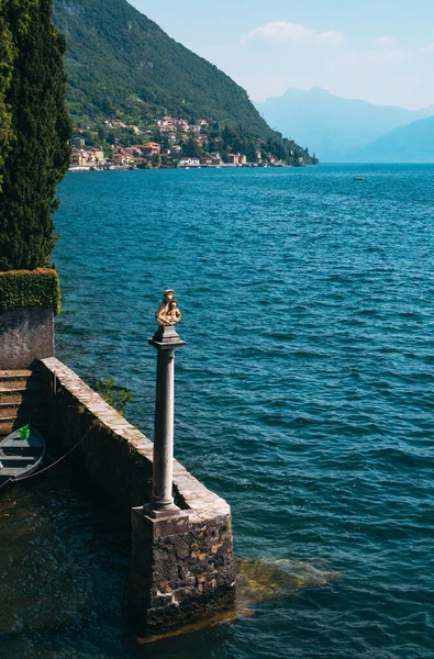 stock image Beautiful sculpture on the coast of Lake Como, near Villa Monastero with spectacular lake and mountains view. Varenna, Province of Lecco, Italy.