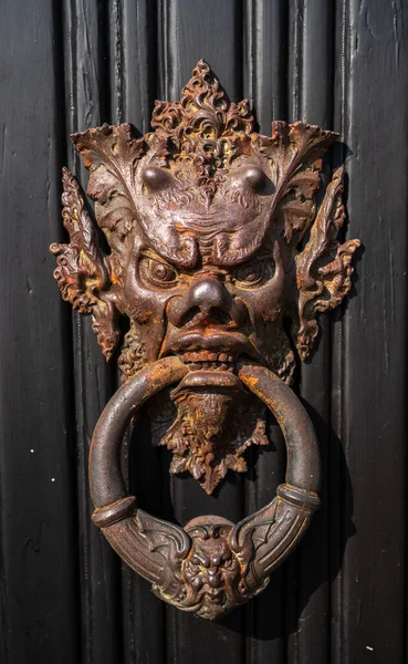 Fascinating art installation on one of the entrance doors to the historic Villa Monastero, the villa of lords, Varenna, Province of Lecco, Italy.