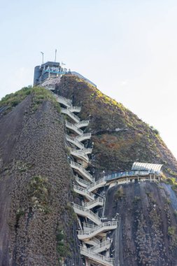 The Rock of El Penol with its staircase leading to the summit, located in Guatape, Antioquia, Colombia, a popular tourist destination in South America clipart