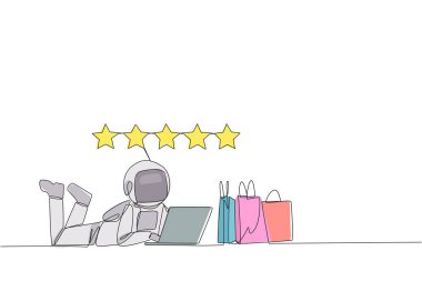 Single continuous line drawing young astronaut on stomach while typing on laptop. Next to the laptop is shopping bag. Give the best review with pleasure. Spaceman. One line design vector illustration clipart