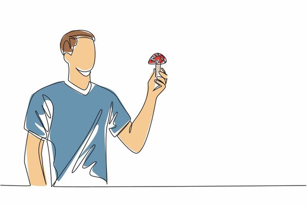 Single one line drawing man in casual clothes holding poisonous mushroom. Explaining inedible mushrooms. Harmful to the body. Danger. Day of the Mushroom. Continuous line design graphic illustration