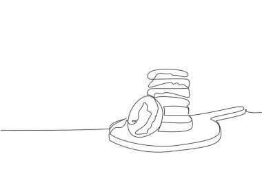 Yuvarlak ahşap kesme tahtasına yulaflı kurabiyeler çizmeye devam et. Sağlıklı yaşam sağlıklı kahvaltıyla başlar. Ulusal Yulaflı Kurabiye Günü. Tek çizgi çizimi tasarım vektör çizimi