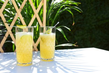 Refreshing summer cocktail, melon smoothie with ice and lime. The concept of vegetarian summer drinks. Ideal for detox.