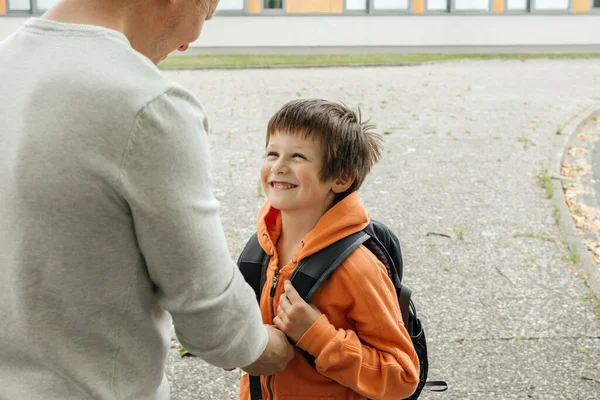 Father Helps His Son Put Backpack Child Happy Back School — Stock Photo, Image