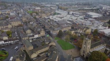 Aerial drone footage of the village of Keighley, Bradford in the UK showing rain pouring down on the village in the Autumn time, British winter bad weather day thriller or horror concept