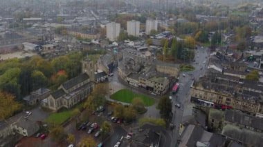 Aerial drone footage of the village of Keighley, Bradford in the UK showing rain pouring down on the village in the Autumn time, British winter bad weather day thriller or horror concept