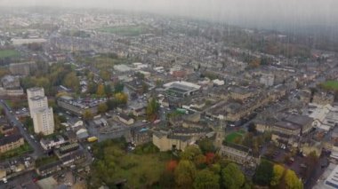 Aerial drone footage of the village of Keighley, Bradford in the UK showing rain pouring down on the village in the Autumn time, British winter bad weather day thriller or horror concept