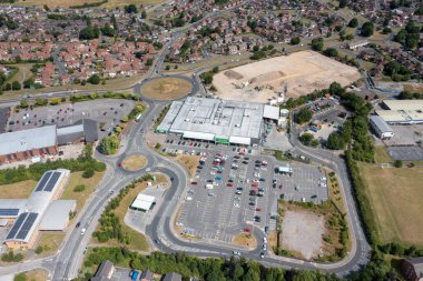 Leeds UK, 14th July 2022: Aerial photo of the Asda Supermarket, taken with a drone on a sunny summers day showing the supermarket and car park