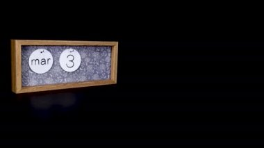 A wooden calendar block showing the date March 31st with a mans hand putting on and taking off the metal discs with the date and month on them, filmed in 8k quality
