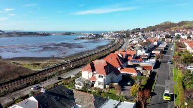 Aerial footage of the town of Deganwy in Conwy County Borough in Wales It lies in the Creuddyn Peninsula alongside Llandudno Rhos-on-Sea showing the Deganwy Marina and railway along the Conwy river