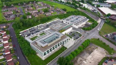 Aerial drone footage of the Police headquarters the city of Leeds west Yorkshire in the UK, showing the new Police building from above in the summer time on a hot sunny day