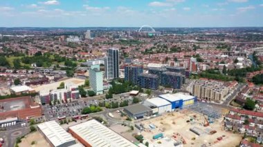 Aerial drone footage of the the large suburb of Wembley  in north-west London in the UK, showing the residential streets and suburban houses and Wembley Stadium