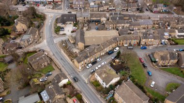 Aerial drone photo of the Village of Netherton near Huddersfield, in the Kirklees metropolitan borough of West Yorkshire, England showing the residential houses in the winter time