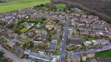 Aerial drone footage of the Village of Netherton near Huddersfield, in the Kirklees metropolitan borough of West Yorkshire, England showing the residential houses in the winter time