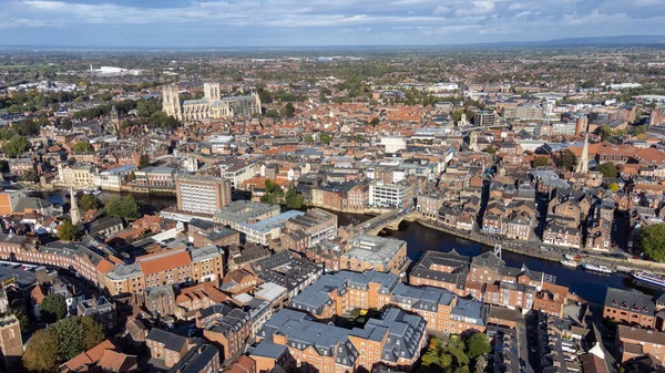 stock image Aerial photo of the town of York located in North East England and founded by the ancient Romans, showing the York Minster Historical Cathedral in the main town centre along the river side.