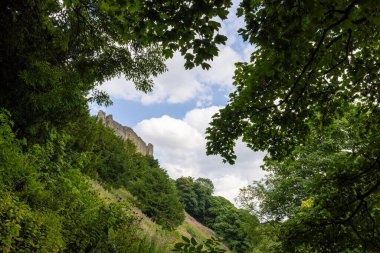 Photo of the beautiful town of Richmond which is a market town and civil parish in North Yorkshire, England showing the historic Richmond Castle on a sunny day in the summer time clipart