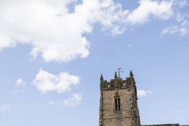 Photo of the beautiful town of Richmond which is a market town and civil parish in North Yorkshire, England showing the historic church building in the town clipart