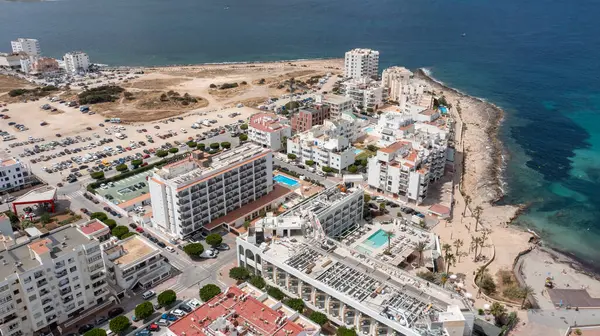 stock image Aerial drone photo of a beach in the town of Sant Antoni de Portmany on the island of Ibiza Balearic Islands Spain showing the ocean front and Cala Alto de Porta beach in the summer time.