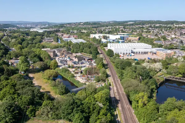 stock image Aerial drone photo of the village of Kirkheaton, Huddersfield in the Kirklees district in the county of West Yorkshire England showing the village and River Calder from above in the summer time.