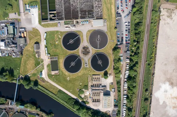 stock image Aerial drone photo of the village of Kirkheaton, Huddersfield in the Kirklees district in the county of West Yorkshire England showing a large water recycling plant in the summer time on a sunny day