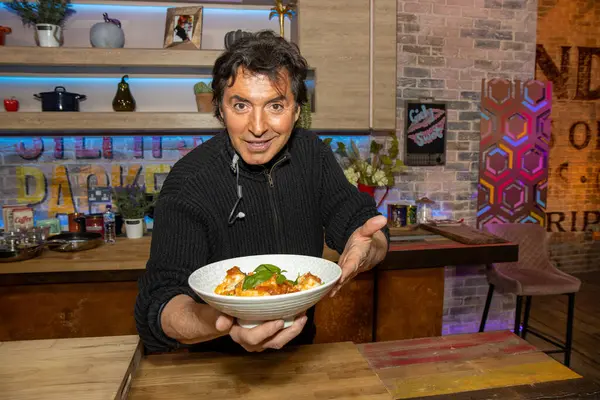 Stock image Leeds UK, 21st Oct 2021: `The French celebrity chef Jean-Christophe Novelli MBE in a kitchen cooking food.