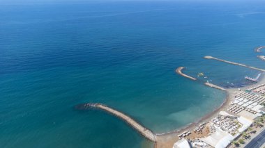 Aerial drone photo of the beautiful town of Alanya a resort town on Turkeys central Mediterranean coast showing a hotel and vacation holiday resort from above in the summer time. clipart