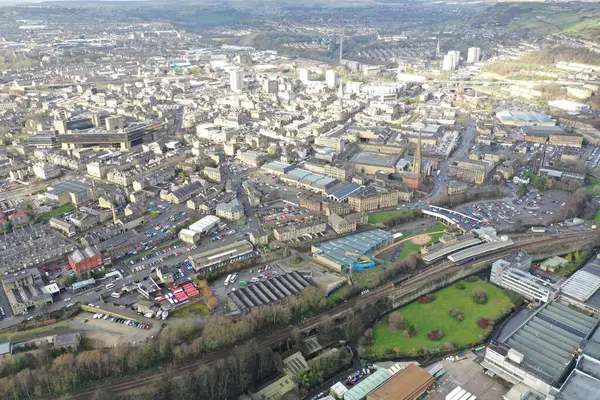 stock image Aerial drone photo of the town centre of the town of Halifax in West Yorkshire showing the old historic buildings and train station on a foggy day in the winter time