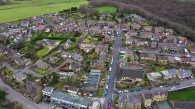 Aerial drone footage of the Village of Netherton near Huddersfield, in the Kirklees metropolitan borough of West Yorkshire, England showing the residential houses in the winter time