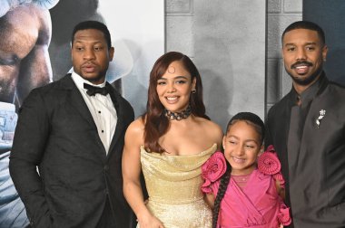 LOS ANGELES, CA. February 27, 2023:  Jonathan Majors, Tessa Thompson, Mila Davis-Kent and Michael B. Jordan at the premiere for Creed III at the TCL Chinese Theatre, Hollywood clipart