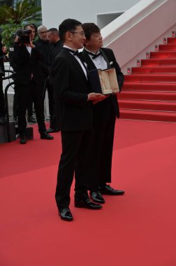 CANNES, FRANCE. May 20, 2024: Goro Miyazaki & Kenichi Yoda at Honorary Palme D'Or To Studio Ghibli Ceremony at the 77th Festival de Cannes clipart