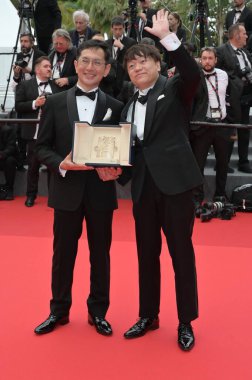 CANNES, FRANCE. May 20, 2024: Goro Miyazaki & Kenichi Yoda at Honorary Palme D'Or To Studio Ghibli Ceremony at the 77th Festival de Cannes clipart
