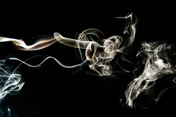 Smoke effect texture. Isolated background. Black and dark backdrop. Smokey fire and mistic effect. Spirit wave. Photo realistic mist stock image.