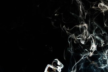 Smoke effect texture. Isolated background. Black and dark backdrop. Smokey fire and mistic effect. Spirit wave. Photo realistic mist stock image.