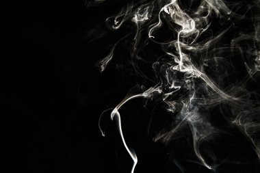 Smoke effect texture. Isolated background. Black and dark backdrop. Smokey fire and mistic effect. Spirit wave. Photo realistic mist stock image.