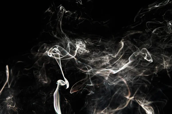 Smoke effect texture. Isolated background. Black and dark backdrop. Smokey fire and mistic effect. Spirit wave. Photo realistic mist stock image.