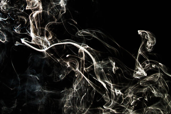 Smoke effect texture. Isolated background. Black and dark backdrop. Smokey fire and mistic effect. Spirit wave. Photo realistic mist stock image.
