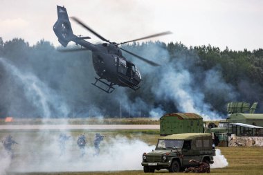 Kecskemet, Hungary - August 28, 2021: Military helicopter at air base. Air force flight transportation. Aviation and rotorcraft. Transport and airlift. Military industry. Fly and flying.