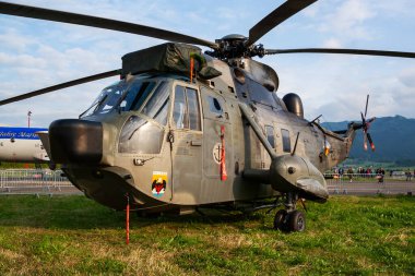 Zeltweg, Austria - June 28, 2013: Military helicopter at air base. Air force flight operation. Aviation and aircraft. Air defense. Military industry. Fly and flying.