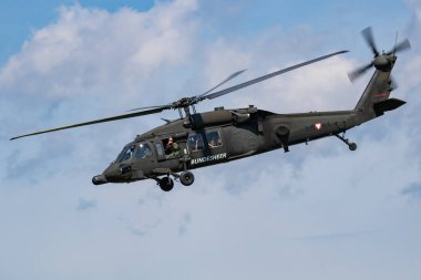 Zeltweg, Austria - September 3, 2016: Military helicopter at air base. Air force flight operation. Aviation and aircraft. Air defense. Military industry. Fly and flying.