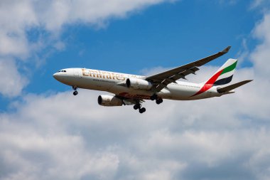 Budapest, Hungary - May 11, 2015: Emirates passenger plane at airport. Schedule flight travel. Aviation and aircraft. Air transport. Global international transportation. Fly and flying.