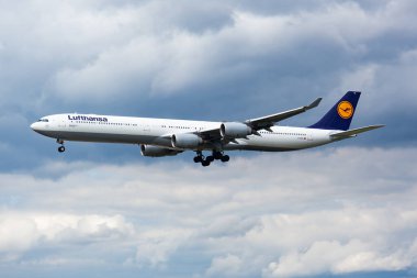 Frankfurt, Germany - August 17, 2014: Lufthansa passenger plane at airport. Schedule flight travel. Aviation and aircraft. Air transport. Global international transportation. Fly and flying.
