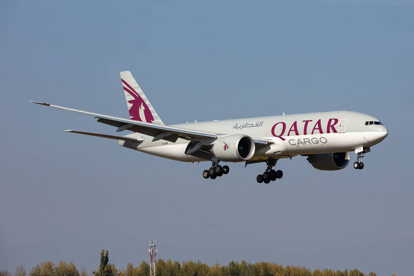 Budapest, Hungary - October 17, 2021: Qatar Airways Cargo Boeing 777-200 cargo plane at airport. Air freight and shipping. Aviation and aircraft. Transport industry. Transportation. Fly and flying.