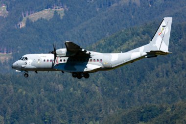Zeltweg / Austria - September 4, 2019: Polish Air Force CASA C-295 023 transport plane with support landing at Zeltweg Air Base clipart