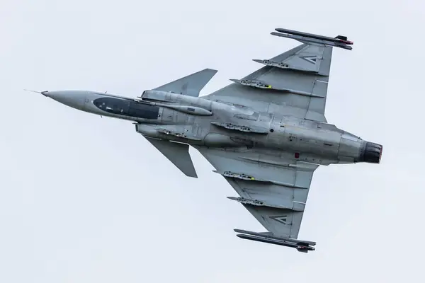 stock image Malacky, Slovakia - September 1, 2023: Hungarian Air Force SAAB JAS 39 Gripen fighter jet plane flying. Aviation and military aircraft.