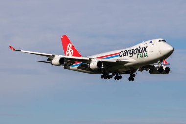 Amsterdam, Netherlands - July 4, 2017: Cargolux Italia cargo plane at airport. Air freight and shipping. Aviation and aircraft. Transport industry. Global international transportation. Fly and flying. clipart