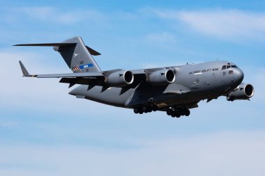 Papa, Hungary - May 10, 2021: Boeing C-17 Globemaster III Military transport plane at air base. Air force flight. Aviation and aircraft. Air lift. Fly and flying. clipart