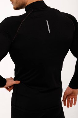 Athletic man in thermal underwear on a white background. Thermal underwear for men