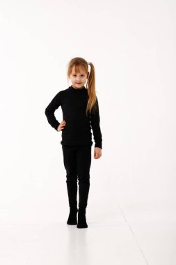 Brother and sister in thermal clothes on a white background.