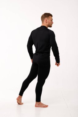 Athletic man in thermal underwear on a white background. Thermal underwear for men